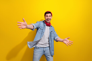 Canvas Print - Photo of funky impressed man dressed jeans shirt enjoying music open arms ready hug you isolated yellow color background