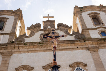 Wall Mural - Catholic is seen raising the cross of Jesus Christ in front of the Senhor do Bonfim Church in the city of Salvador, Bahia.