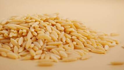 Sticker - closeup of brown long rice on table .