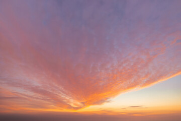 a beautiful sky tinted by the sun leaving vibrant shades of gold, pink, blue and multicolored. cloud