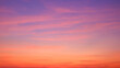 © Prapat - Sunset sky background with beautiful pink sunset clouds on colorful yellow, orange, and blue purple sunlight on romantic evening twilight sky