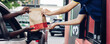 © kanpisut - Hand Man in car receiving coffee in drive thru fast food restaurant. Staff serving takeaway order for driver in delivery window. Drive through and takeaway for buy fast food for protect covid19.