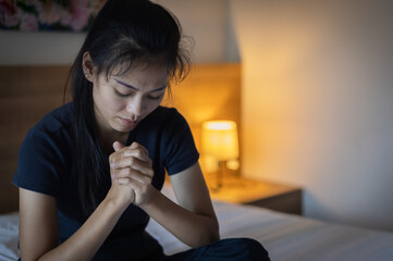 Wall Mural - Hands folded in prayer concept for faith, Religious young woman praying to God in the morning, spirtuality and religion, Religious concepts.