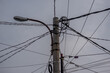 Connection of high voltage electric cables on electricity poles to supply electricity to residential areas. Electricity is a basic need of modern society