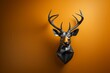 A geometric 3D render presents a deer head on a wall, showcasing the beauty of low poly art.
