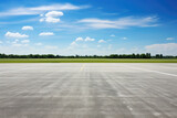 Fototapeta  - Airport runway and blue sky with white clouds, perspective view