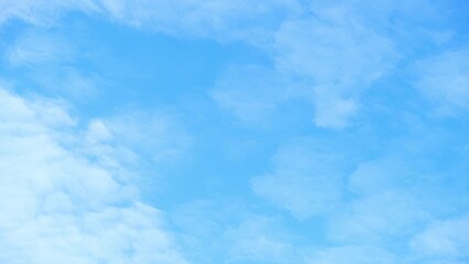 Wall Mural - A mesmerizing time-lapse of the azure heavens, streaked with cotton candy clouds racing across like dreams in fast-forward. Nature's artistry in motion. Timelapse. Nature concept.

