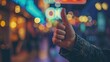 Hipster man showing thumbs up on bokeh background