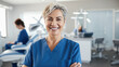 © MP Studio - Portrait of female dentist in clinic