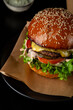 Close up of junk food american burger black surface