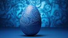 A Blue Egg Sitting In Front Of A Blue Wall With A Pattern On It's Side And A Blue Background Behind It.