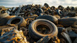 Pile of old tires for rubber recycling. Treatment of used tires and wheels in an industrial landfill.