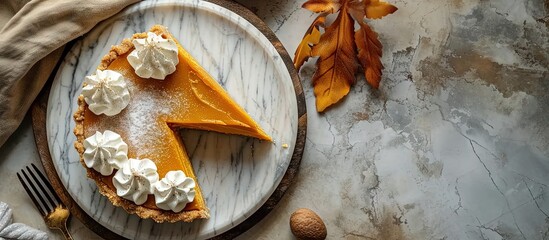 Poster - Pumpkin cheesecake swirl pie topped with whipped cream on a marble board original Thanksgiving dessert idea. Creative Banner. Copyspace image