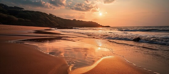 Wall Mural - sun at om beach golden light reflecting on sand sunrise at om beach in gokarna karnataka. creative b