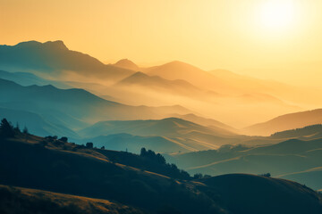 Sunrise above the misty mountains landscape in gold and dark cyan