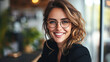 © Kowit - Portrait of a professional woman in a suit standing in a modern office. Mature business woman looking at the camera in a workplace meeting area.