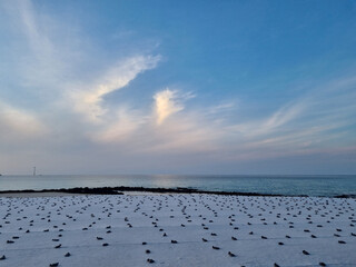 Wall Mural - An evening beach with sandbags on it.