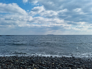 Canvas Print - It is a beach with round pebbles.