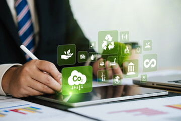CO2. Concept showing the problem of carbon dioxide and CO2 emissions on the environment, global warming, sustainable development. Businessman investigates and solves world problems. Renewable energy