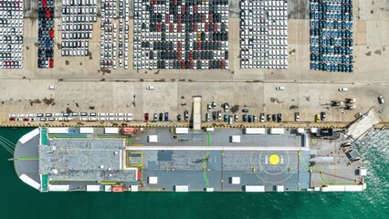 Wall Mural - Aerial view, new car lined up in the port for import and export business logistic to dealership for sale.Automaker distribution center with new vehicles.Aerial view, new car freight shipping by ship.