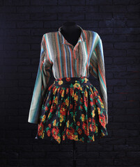 Poster - colorful skirt and colored blouse on a mannequin