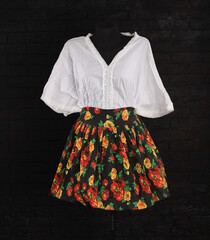 Canvas Print - colorful skirt and white blouse on a mannequin