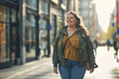 Confident overweight woman walking the city street