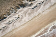 aerial overhead shot of sand beach
