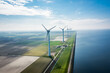 © Denis Feldmann - wind turbines at the sea coast from the sky