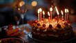 A birthday cake with lit candles, perfect for celebrating a special occasion. Can be used for birthday party invitations or to capture the excitement of blowing out candles