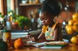 A little girl sitting at a table, focused on writing on a piece of paper. Suitable for educational or creative projects