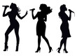 Silhouettes Of Female Singers Performing On Stage