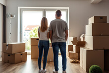 A New Chapter For A Young Couple, As They Unpack In Their First Home, A Testament To The Significance Of Real Estate Choices And Home Loans In Family Life.
