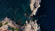 Aerial shot of kayak group tour exploring coastline of Mallorca, Spain. Drone view of kayakers paddle over coral reef and turquoise clear blue water. Fun sport activity for family on vacation