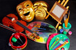 Attributes of the arts. Painting, music, theater. Canvas, palette, brushes, paints. Violin, bow, tambourine, maracas. Masks of tragedy and comedy.