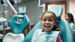 © Nikolay - A six-year-old girl smiles in the dentist's office
