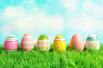 Colorful Easter eggs on green grass. Spring holidays concept.