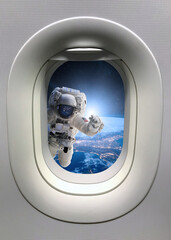 Wall Mural - astronaut in outer space from porthole. elements of this image furnished by nasa.
