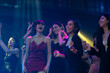 © NVB Stocker - Sexy young woman people dancing and holding champagne glass in night club. Happy fun Asian people dance in night club. Nightlife and disco dance party concept. Fun music festival