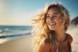 Close up portrait of beautiful blond woman in sexy swimwear posing on the beach in sunset light. Perfect wavy hairs, tan skim body. Summer tropical mood.