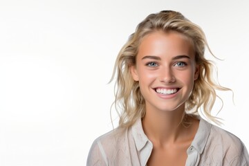 Wall Mural - closeup portrait of young happy woman looking in camera over white background.