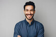 © Prasanth - Handsome smiling business man in blue shirt isolated on gray background