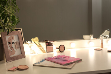 Poster - Dressing table with cosmetics and glowing mirror in dark makeup room