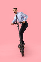 Sticker - Handsome businessman with kick scooter on pink background