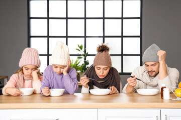 Sticker - Ill family eating soup at table in kitchen