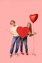 Poster - Little children with paper heart and balloon on pink background. Valentine's Day celebration