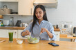 © Charlie's - Asian woman dieting Weight loss eating fresh fresh homemade salad healthy eating concept