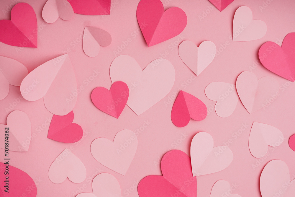 Paper hearts on pink background. Valentine's Day celebration
