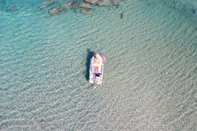 Sea Background Texture. Aerial Drone View Of Inflatable Boat In Elafonisi Island Water Greece.