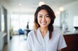 © vasyan_23 - Happy asian woman medical assistant in clinic. Nurse in uniform doctor at hospital